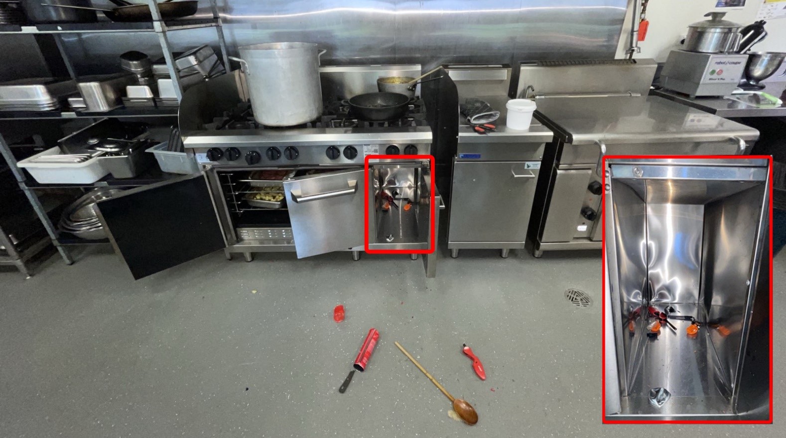 The image shows the oven storage's compartment that was damaged due to heat from the butane gas canister which was stored in it. 