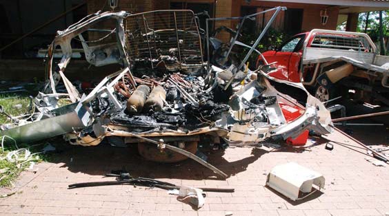 Image shows the destroyed Toyota HiAce Van.