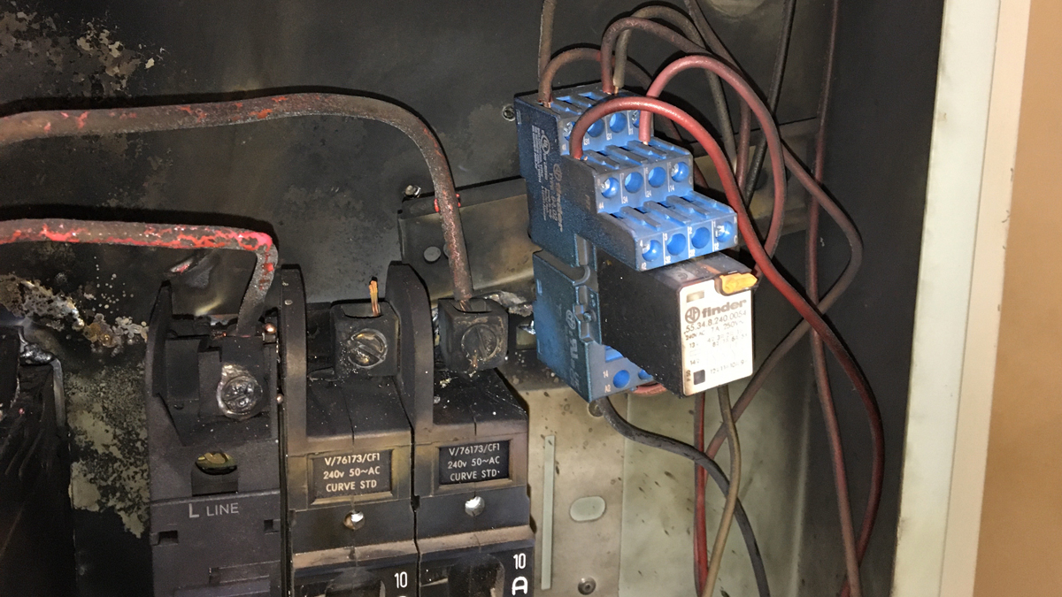 The image shows to scorched inside of the switch board after the arc flash incident.