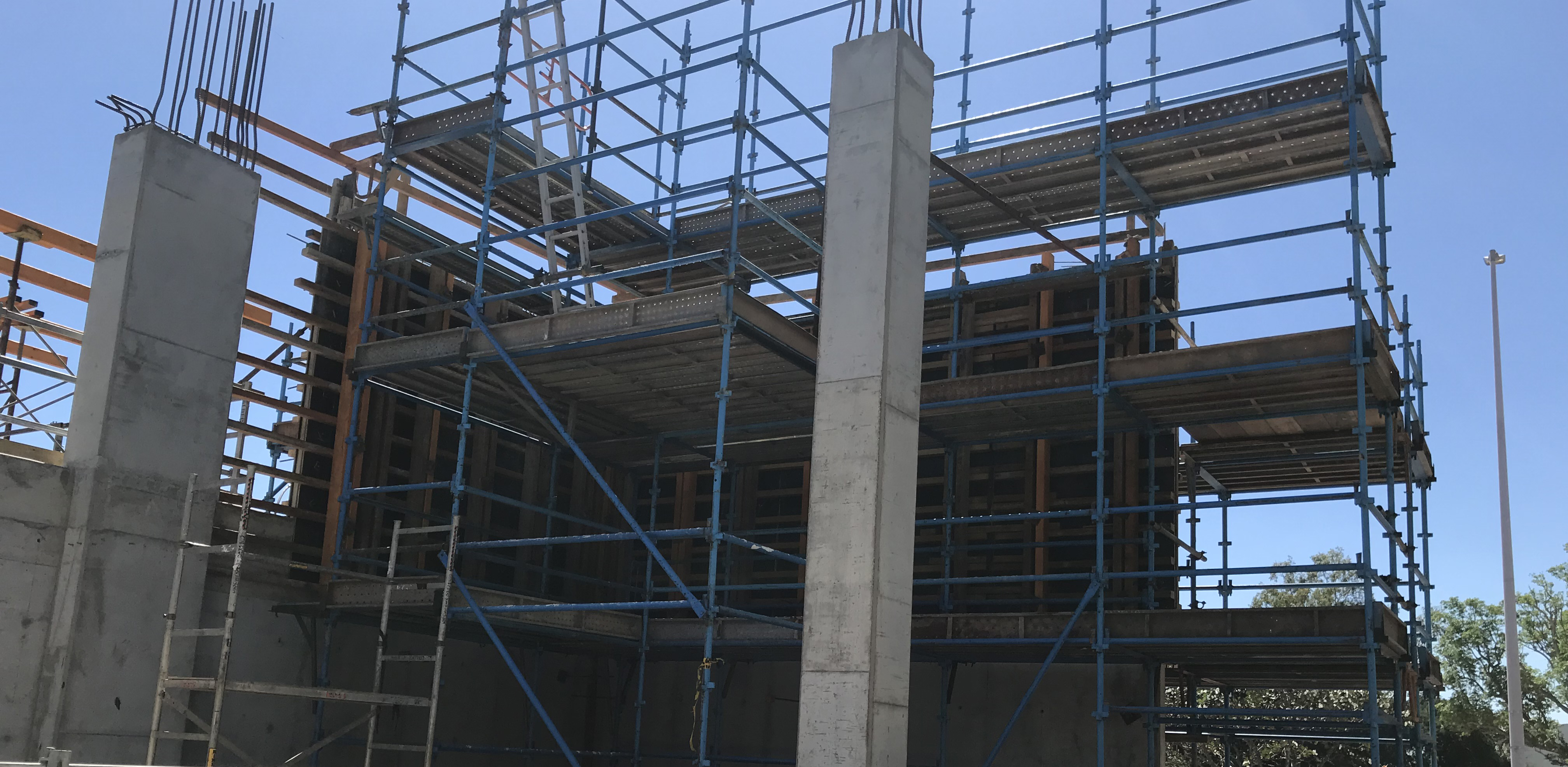 The image shows scaffolding erected at a construction site.