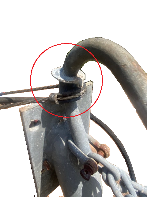 Figure 2: Stainless steel braided wire attached to metallic gooseneck riser hook, attached to metal roof. Figure 2: Stainless steel braided wire attached to metallic gooseneck riser hook, attached to metal roof.