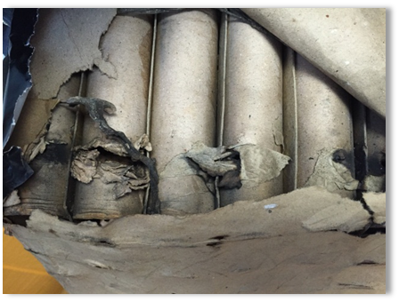 Ruptured cardboard tubes in a fan cake. Image shows the ruptured cardboard tubes in a fan cake