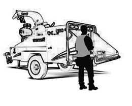 Feed the wood chipper from the side of the feed table. Image shows a worker feeding the wood chipper from the side of the feed table.